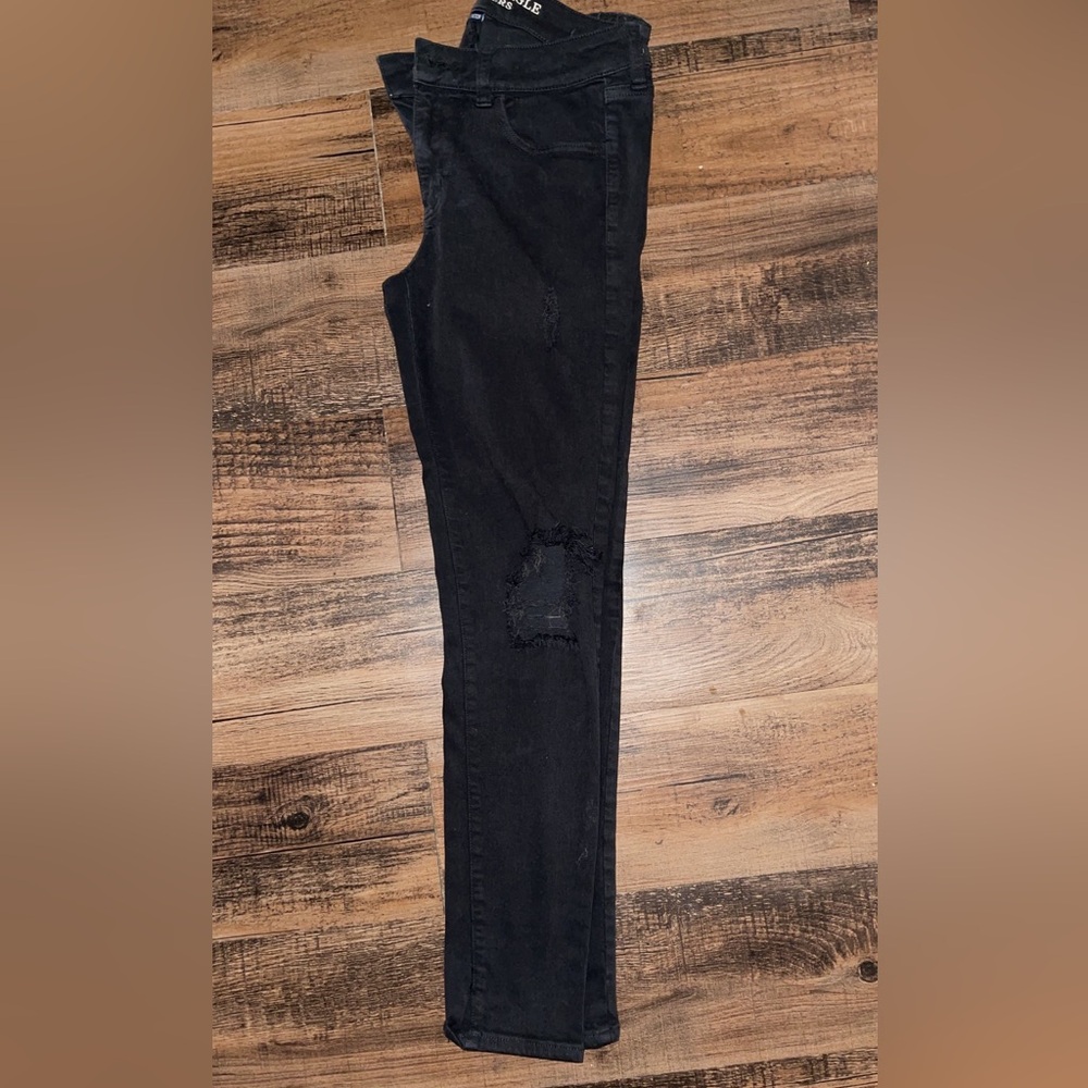 Faded charcoal black ripped AE jeggings